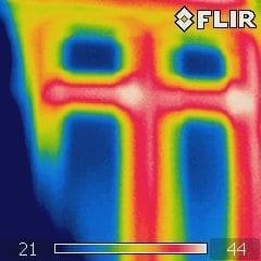 red and white thermal imaging picture of heat loss from a thermal imaging inspection